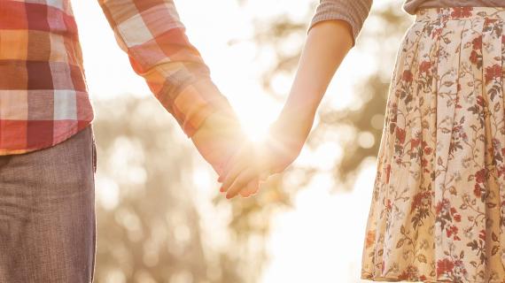 married couple holding hands